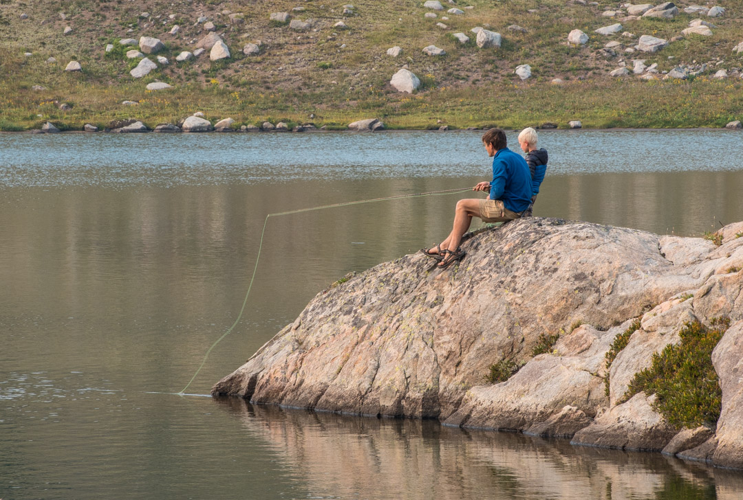 father and son fly fishing together