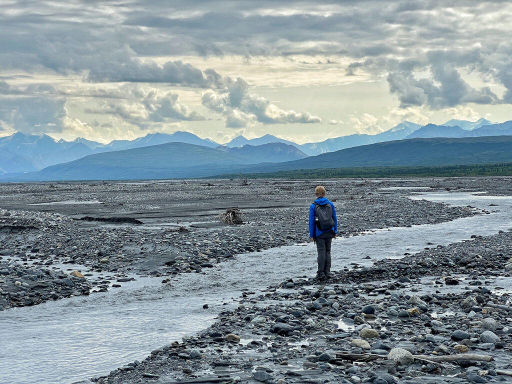 Young George standing on McKinley Bar Visiting Denali